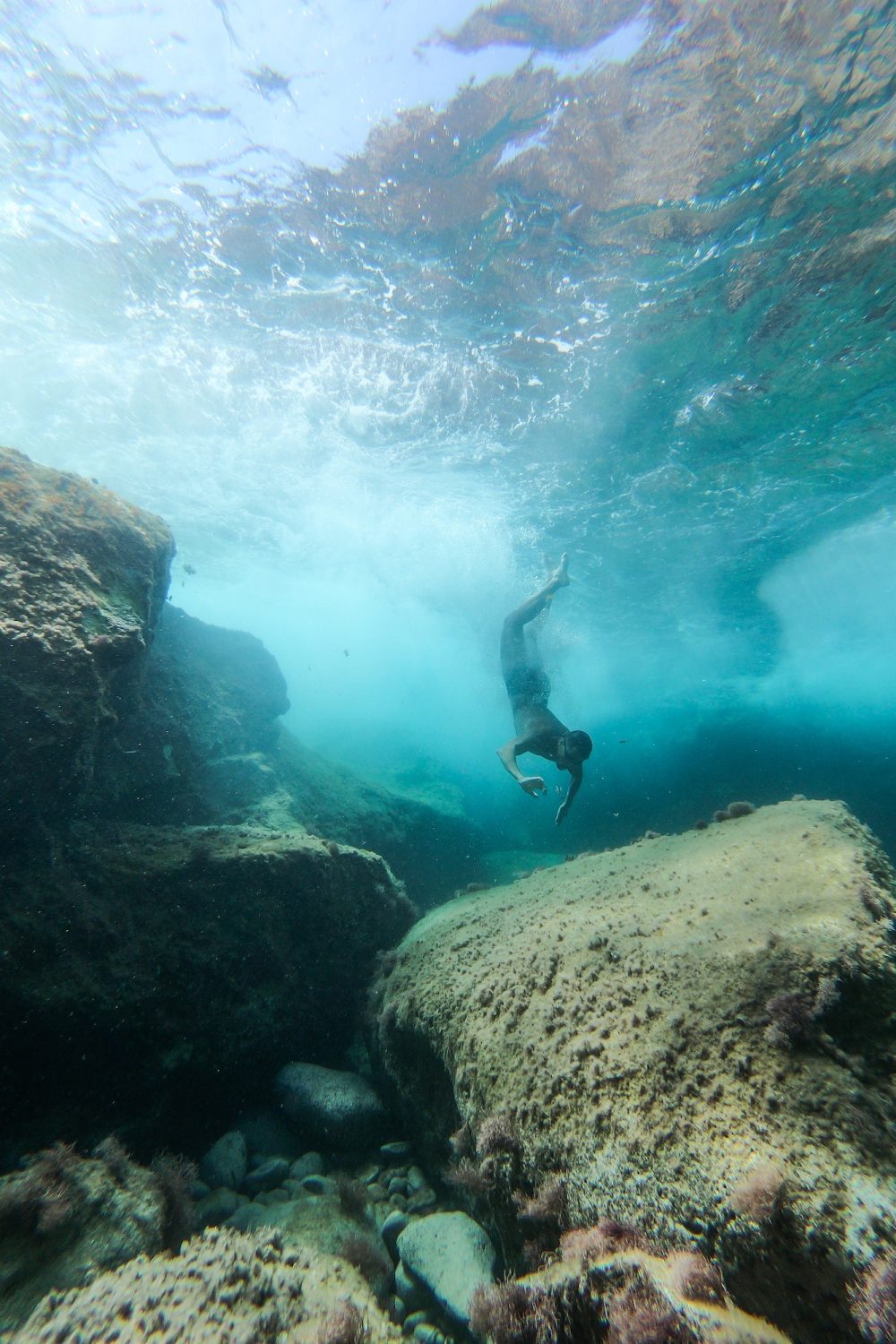 Woman diving into the sea.